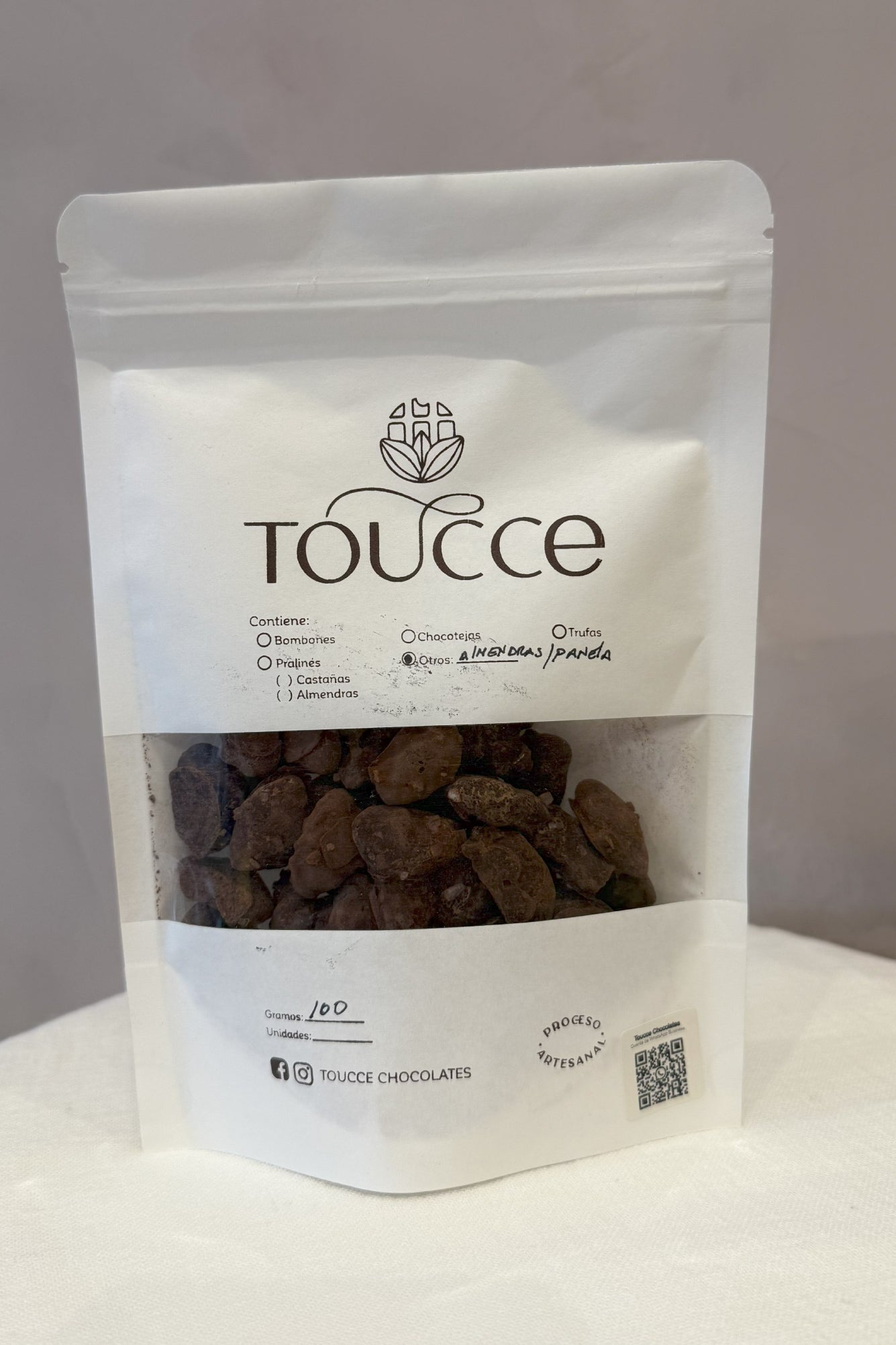 Almendras bañadas en chocolate premium Toucce, 80 gr